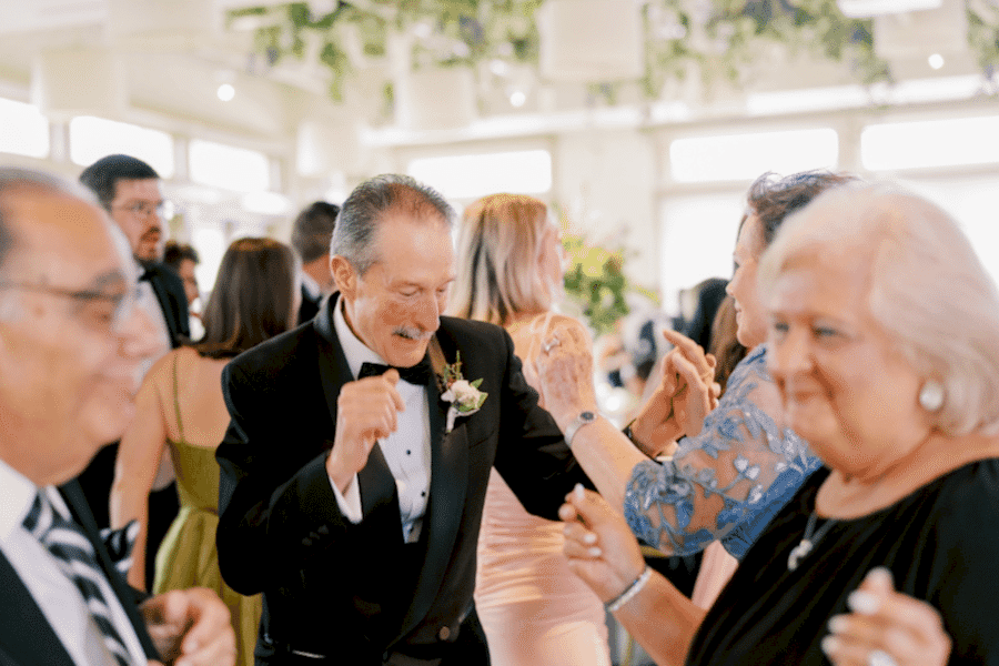 Smiles and dancing to the music.