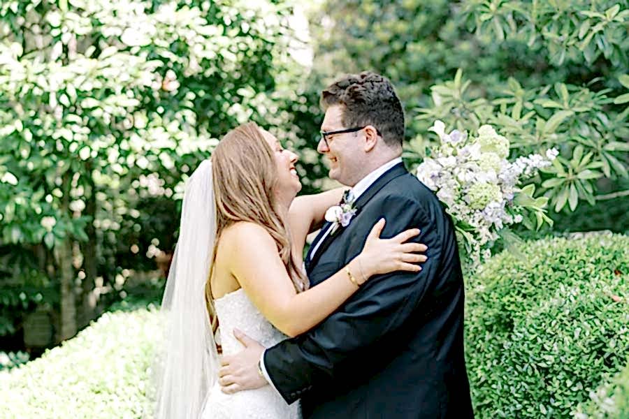 The Bride and Groom gaze at each other in the Bluebell Garden