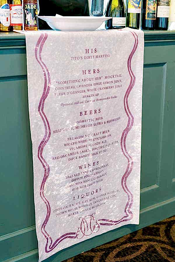 A bar menu with His and Her Cocktails Listed